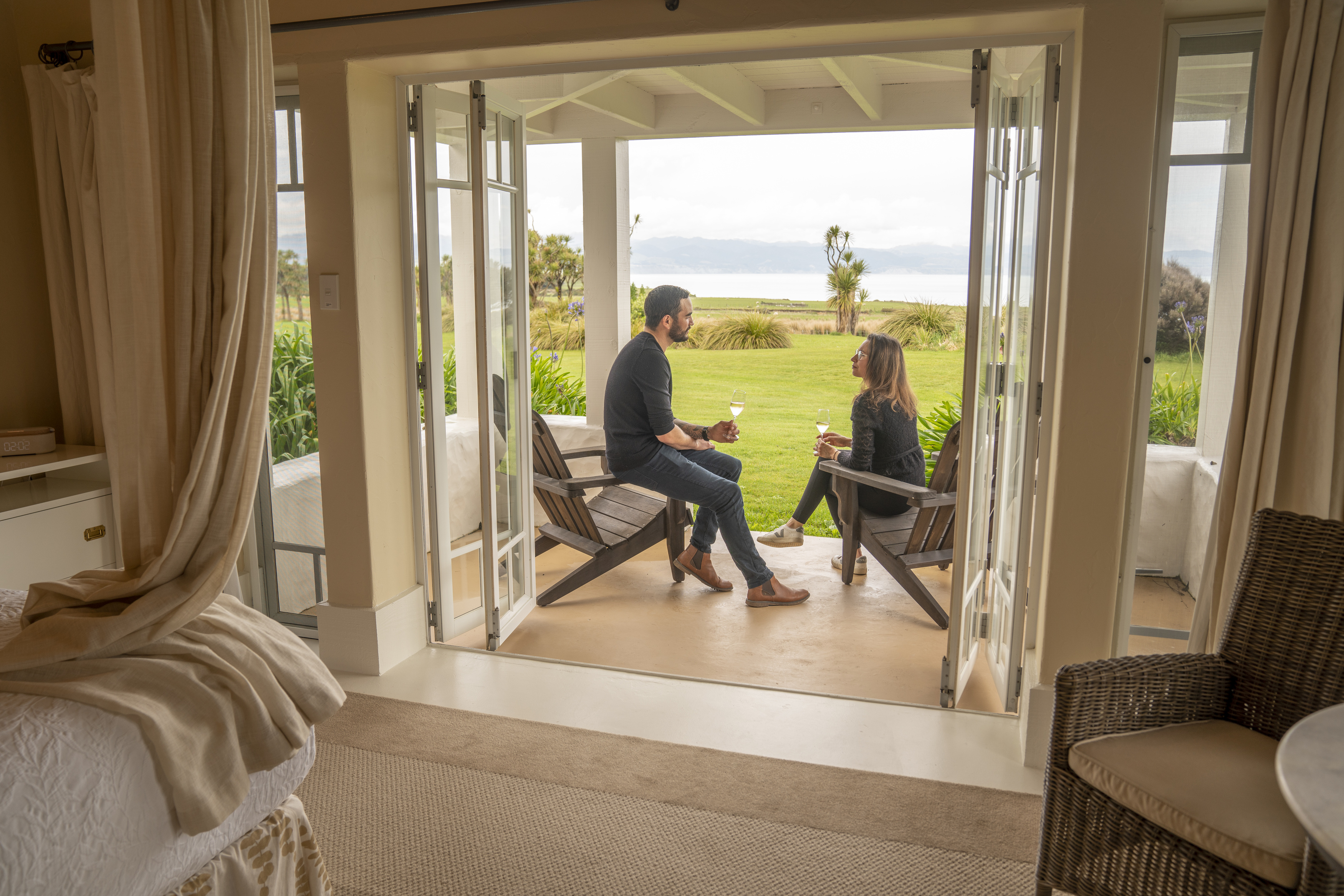 a couple sharing a romantic moment at Wharekauhau